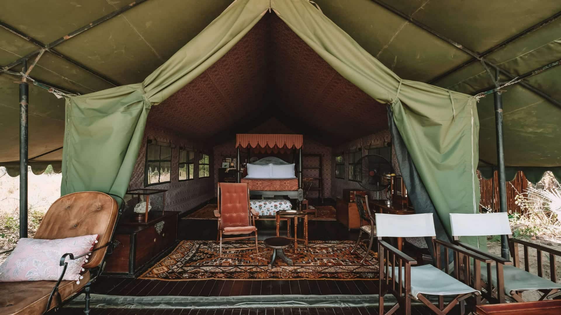 A tented bedroom with Persian carpet at Jack's Camp
