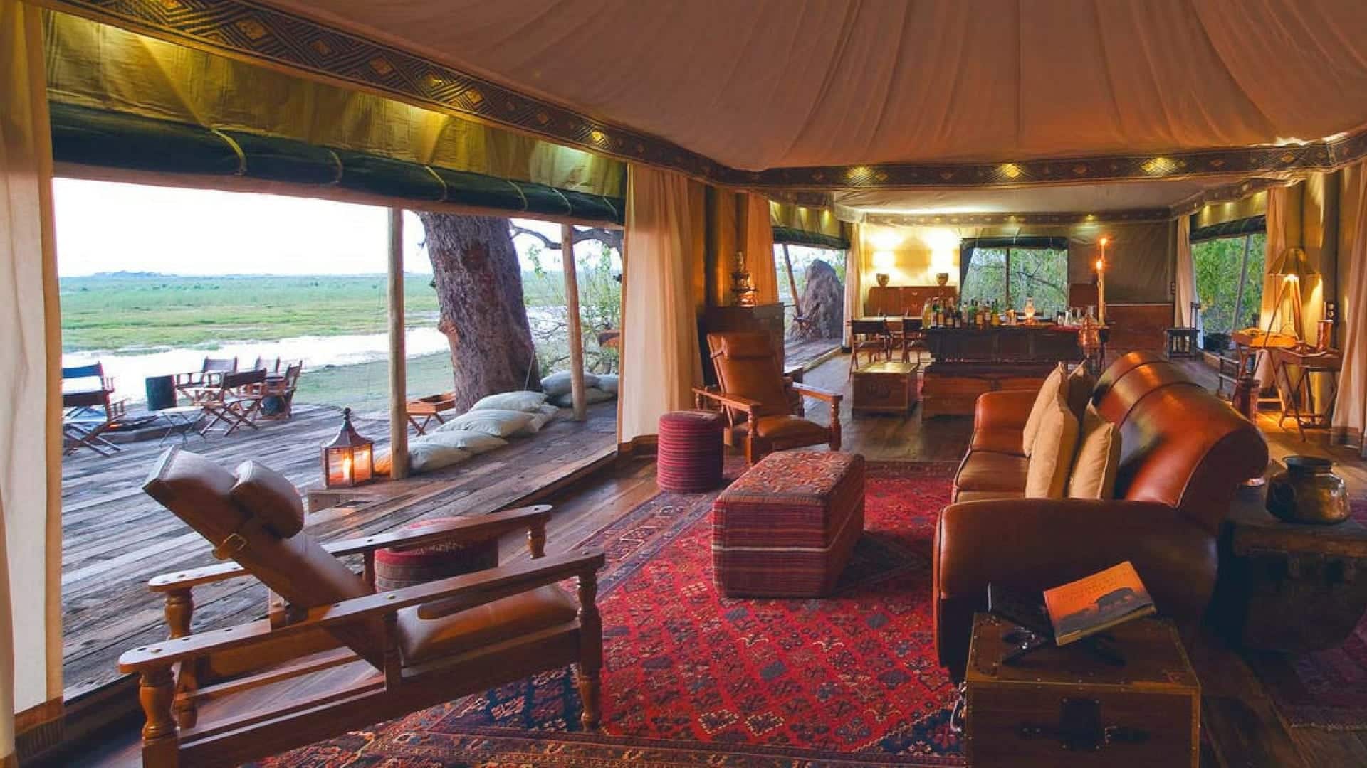 A tented interior with antique trunk as coffee table at Zarafa - Botswana