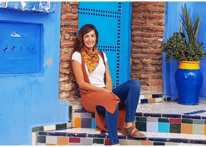 Tanaya Lambert sat on colourful steps