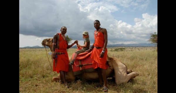 Maasai and child on camel
