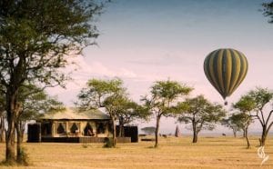 A hot air balloon flying over Singita Sabora