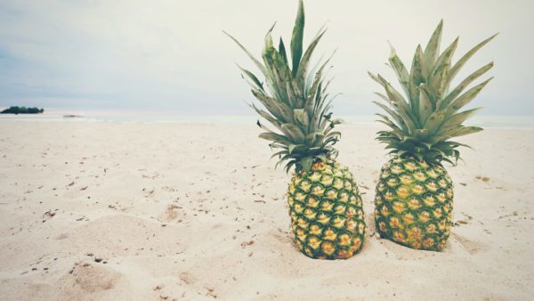 Two Pineapples on a beach