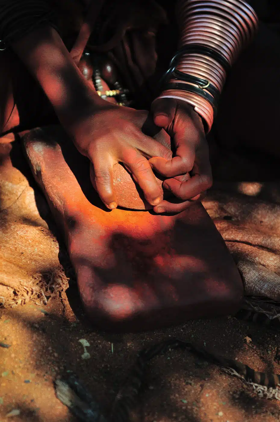 Himba Woman Grinding Ochre